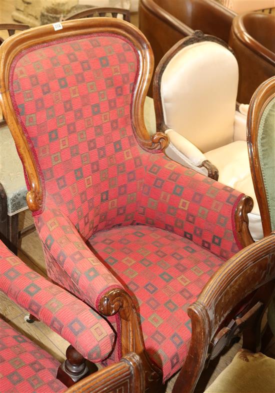 An upholstered spoonback armchair